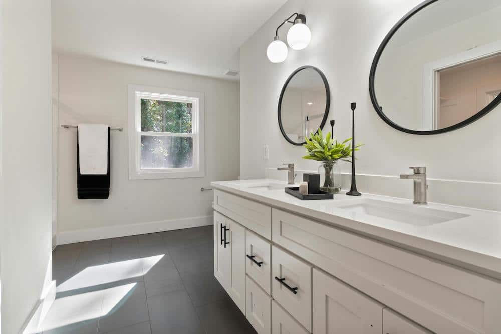 white double sink with task lighting