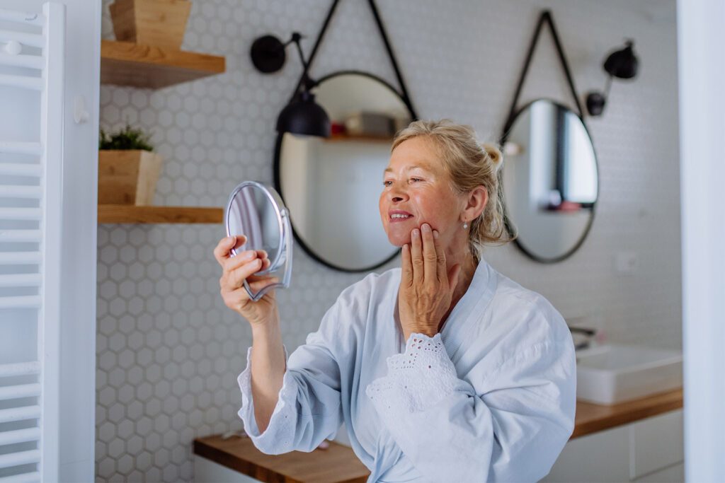 woman looking in a mirror