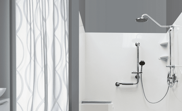 walk-in shower with a bench and shower head