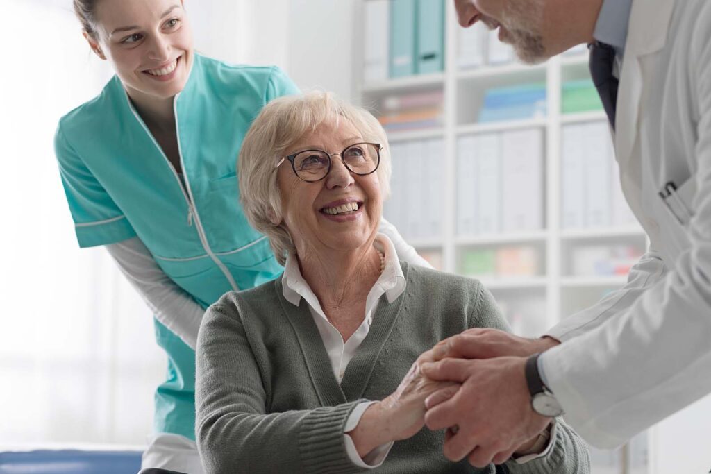 elderly woman speaking with her doctor