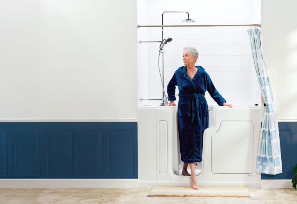 woman stepping out of her hybrid walk in tub