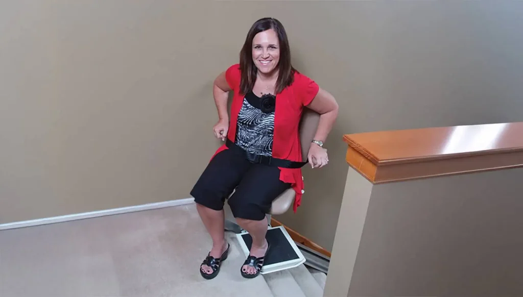 woman sitting on indoor stairlift