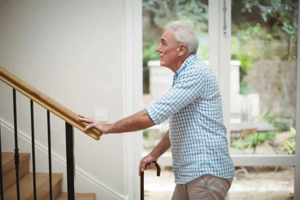 Senior man going up the stairs